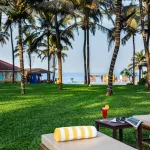 Beachfront resort in Candolim, North Goa with lush tropical surroundings