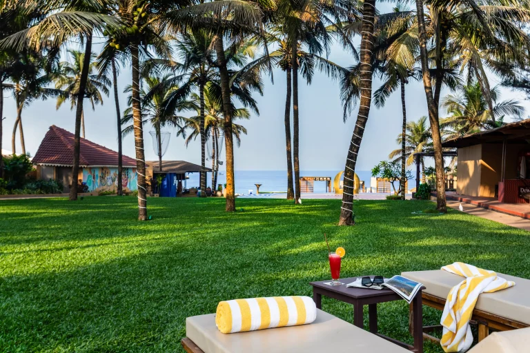 Beachfront resort in Candolim, North Goa with lush tropical surroundings